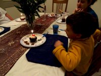 DSC00565 - Version 2  Birthday celebration:  Since the visit was in between the boys' birthdays, we had one big celebration.  Ethan blows out the candle on his cupcake. : From MobileMe