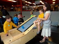 DSC00634  San Francisco:  Exploratorium:  Ethan tries out one of the exhibits while Aidan and Brooke observe. : From MobileMe